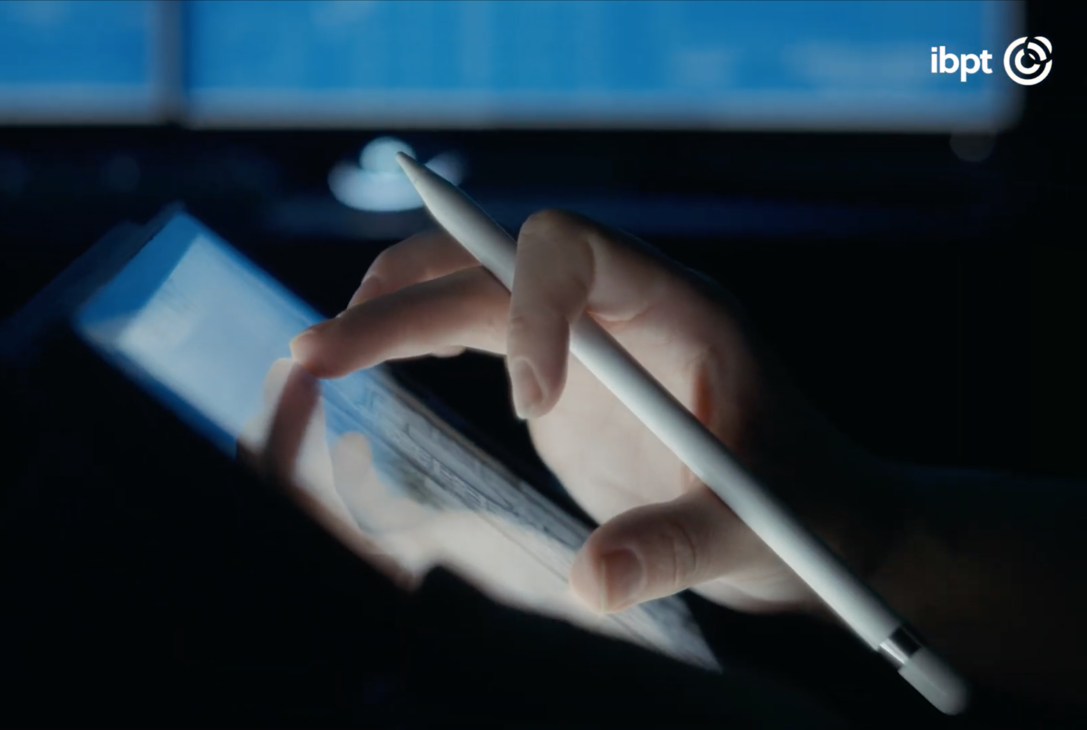 A photo showing a tablet computer, with a person’s hand zooming in on an object on the screen 